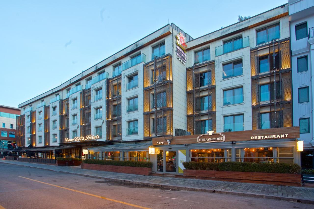 ดอสโซ่ ดอสซี่ โฮเต็ล แอน์ สปา ดาวน์ทาวน์ Hotel อิสตันบูล ภายนอก รูปภาพ The photo shows a modern hotel building with multiple stories. The façade features a mix of glass and concrete elements, giving it a sleek and contemporary look. There are several large windows across the building, allowing for plenty of natural ligh
